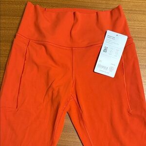 NWT Athleta Transcend Stash tight 7/8 legging size medium